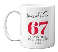 67th Birthday Gifts for Women Men, Cheeky Novelty Mug Young at Heart, Gag Joke Gifts, Perfect Funny Mugs for Sixty-Seven Sixty-Seventh Birthday Present, 11oz Ceramic Coffee Mugs
