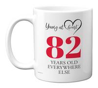 82nd Birthday Gifts for Women Men, Cheeky Novelty Mug Young at Heart, Gag Joke Gifts, Perfect Funny Mugs for Eighty-Two Eighty-Second Birthday Present, 11oz Ceramic Coffee Mugs