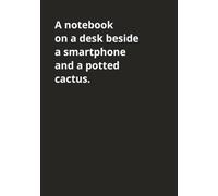 A notebook on a desk beside a smartphone and a potted cactus: Quirky and bold journal/notebook with 120 blank ruled pages with margin. 7x10 inch ... because life doesn't have to be boring.