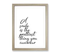 A Smile Is The Prettiest Thing You Can Wear Typography Quote Framed Wall Art Print, Ready to Hang Picture for Living Room Bedroom Home Office Décor, Oak A2 (64 x 46 cm)