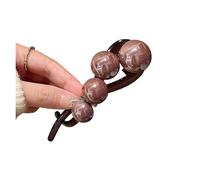 A Woman Is Twisting Her Hair Clip At The Back Of Her Head(Dark coffee)