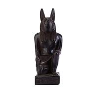 Ancient Egyptian statue of seated God Anubis Jackal Dog Black solid stone made in Egypt.Anubis also called Anupu, god of the dead, represented by a Jackal