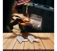 Anti curling edge positioning tool compatible with overlock sewing machines featuring stainless steel rule for stable fabric placement and cutting protection