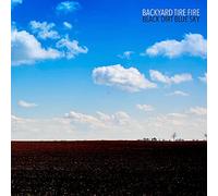 Backyard Tire Fire - Black Dirt Blue Sky
