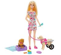 Barbie. Doll and dog in a pram