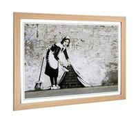 Big Box Art Framed Print of Banksy Maid Sweeping Graffiti Design | Wall Art Picture | Home Decor for Kitchen, Living Room, Bedroom, Hallway, Oak, A2 / 24.5x18 Inch / 62x45cm