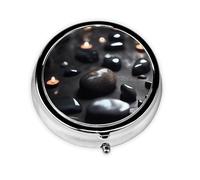 Black Mystery Heart Stone A Round Mini Pillbox with Three Compartments for Storing Vitamins, Fish Oil, and Nutritional Supplements.