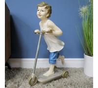 Boy On Scooter Garden And Home Ornament
