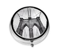 Brooklyn Bridge This Small, Round Pill Box is a Portable Travel Medicine Organizer with Three compartments for Storing Daily medications.