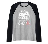 by The Grace of God I'm A Survivor Faith Raglan Baseball Tee
