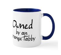 CafePress Owned by an Orange Tabby Mug 11 oz (325 ml) Ceramic Coffee Mug