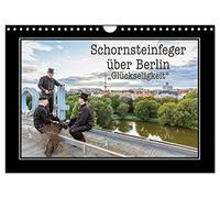 Calendar 2027 · US Version · Chimney sweep over Berlin - bliss | The popular lucky charms from the trade are, of course, the chimney sweeps · 12" × 8" Landscape · CALVENDO Wall Calendar