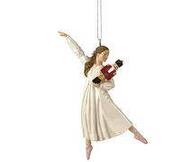 Clara Holding a Nutcracker Christmas Ornament
