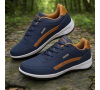Comfortable casual men's blue leather shoes, stylish breathable flat sneakers, waterproof low-top smart casual business shoes, with cushioned white tennis-style sneakers featuring a black contrasting