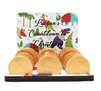 Create Cherished Holiday Memories with Our Personalised Christmas Chocolate Coin Advent Calendar - A Festive Keepsake with Custom Name, Chocolate Slots, 17 Designs (Christmas Dinosaurs)