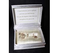 Crystal Glass 18th Birthday key is gilted in 24kt gold and comes in an Ivory white material satin lined box. Personalised gift.
