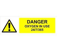 Danger, oxygen in use 24/7/365, warning sign - Self adhesive sticker (300mm x 100mm)