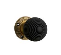 Designer Levers Queen Anne Reeded Door Knob, Antique Brass | Natural wood/antique brass; 53mm; includes two unsprung knobs, spindles, screws; dark wood.