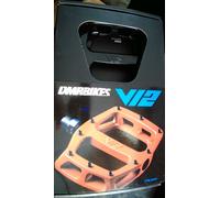 DMR V12 Platform Pedals in black. 430g (pair) 100mm x 95mm (platform). Slim 16mm