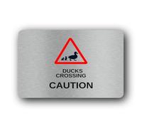 Duck crossing caution sign, indicating the presence of ducks crossing a road or path. Sign - 9.5x9.5cm Brushed Aluminium
