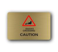 Duck crossing caution sign, indicating the presence of ducks crossing a road or path. Sign - 9.5x9.5cm Brushed Aluminium