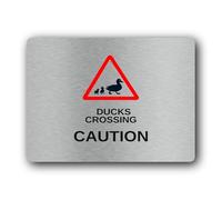 Duck crossing caution sign, indicating the presence of ducks crossing a road or path. Sign - 9.5x9.5cm Brushed Aluminium