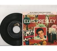 ELVIS PRESLEY - "Santa Claus Is Back In Town", "I'll be Home For Christmas", "Santa Bring My Baby Back To Me", and "Blue Christmas".