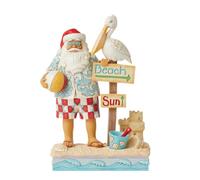 Enesco Jim Shore Heartwood Creek Coastal Santa with Beach Signs and Pelican Figurine, 9.45 Inch, Multicolor