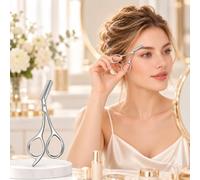Eyebrow Comb Scissors with Curved Handles for Brow Trimming and Shaping | The silver eyebrow scissors have curved handles, two finger loops, a short blade, and an attached comb for routine grooming.