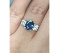 Faith Diamonds 18ct Yellow Gold with Platinum Head 2.37ct Oval Sapphire with 1.00ct D/E Colour Round Brilliant Three Stone LAB Grown Diamond Certified