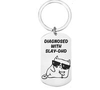 First Glass Designs “Diagnosed with Slay-DHD” Funny Keyring - Stainless Steel Keychain with Cool Cat in Sunglasses - Humorous Gift for Friends, Women & Cat Lovers - Trendy Accessory for Keys or Bags