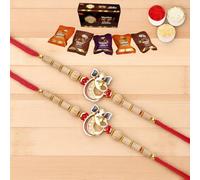Ghasitaram Gifts Jaiccha Rakhis for Brother Rakhis Online - Set of 2 - A-2 Ganesha Divine Rakhi with Asorted Bites Box