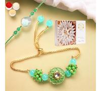 Ghasitaram Gifts Rakhis Online - Rakhi for Brother-T-12 Green Stone Bhaiya Bhabhi Rakhi with 200 GMS of Kaju katli