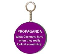 Gift Insanity COCKNEY HUMOUR - PROPAGANDA - WHAT COCKNEYS HAVE WHEN THEY REALLY LOOK AT SOMETHING - WHITE ON PURPLE BACKGROUND - 58mm CHAIN KEYRING