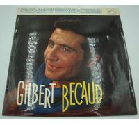 Gilbert Becaud - La Voix De Son Maitre 1093 : Pilou Pilou..he, La chanson pour Roseline, La princesse de juillet, Ah si J'avais des sous, Quand tu n'es pas là, L'enterrement de Cornélius, Marie.. Marie, La marche de Babette, Le rideau rouge - (1 disque vinyle 33t 25cm)