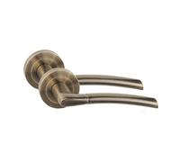 Golden Grace Indiana Antique Brass Door Handles on Rose, 1 Pair | Smooth metal construction offers a comfortable, secure grip, bringing a sleek and elegant touch to interior doors.