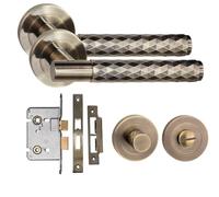 Golden Grace Knurled T-Bar Bathroom Door Handle Set, Antique Brass | Includes spindle, screws and a mortise lock. Diamond cut T-bar handles sit on a sleek 52mm round rose for a modern look.