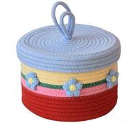Handwoven cotton basket with lid providing structured containment for snacks and quiet decorative support in daily routines (B)
