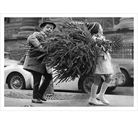 Heading home with the Christmas tree, a 127 x 175mm Alternative Image Christmas card featuring a vintage black and white photo, message inside says Happy Christmas