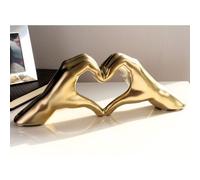 heart ceramic hand sculpture in gold