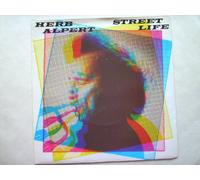 Herb Alpert - Alpert, Herb Street Life 7" A&M AMS7511 EX/EX 1979 picture sleeve, there is a 2mm drill hole in label rim, there is handwritten number on label