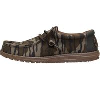 HEYDUDE Men's Mossy Oak Wally Original Bottomland Camo Slip On Shoe | Canvas Upper, Solid Nylon Heel, Elastic Laces, Printed Tassels, Branded Tongue Logo, Soft Foam Insole, Black Speckled Outsole