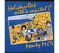 HOLIDAY RAP WITH A CAPITAL C 7" (45) UK DEBUT 1986 B/W MONTY SAYS DON'T SCRATCH THAT B SIDE (DEBT3011) PIC SLEEVE