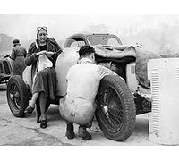 Holy Mackerel knitting between races retro black and white photographic card featuring a vintage image of a female racing driver stopping to knit by her car - 12.6 x 17.7cm and blank inside