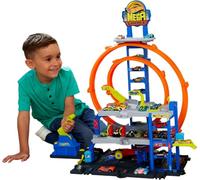 Hot Wheels Mega Loop Garage Track Set with Toy Car & Helicopter | Playset with Die-Cast Vehicle & Chopper, 2 Loops, Storage for 36 1:64 Scale Vehicles, Speed Snap Adapters, JLC05