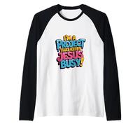 I'm A Project that Keeps Jesus Busy Funny Christian Religion Raglan Baseball Tee