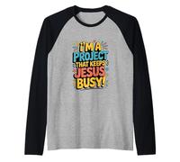 I'm A Project that Keeps Jesus Busy Funny Christian Religion Raglan Baseball Tee