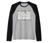 in A World Where You Can Be Anything Be Kind Heart Autism Raglan Baseball Tee