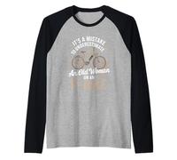 It's A Mistake to Underestimate an Old Woman On an E-Bike Raglan Baseball Tee