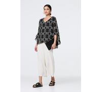 Izabel London Dot Print Semi Sheer Flare Sleeve Blouse for Women UK with a v-Neck and a Curve Layered Hem. Black